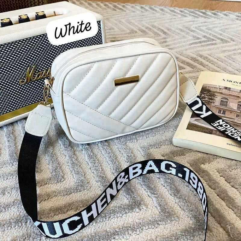 Stylish Black Quilted Crossbody Bag with Gold Accents