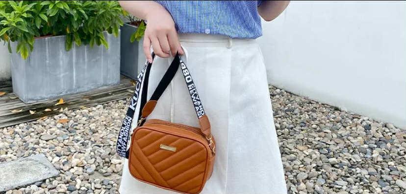Stylish Black Quilted Crossbody Bag with Gold Accents
